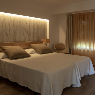 Interior of a bedroom in white and creamy tones